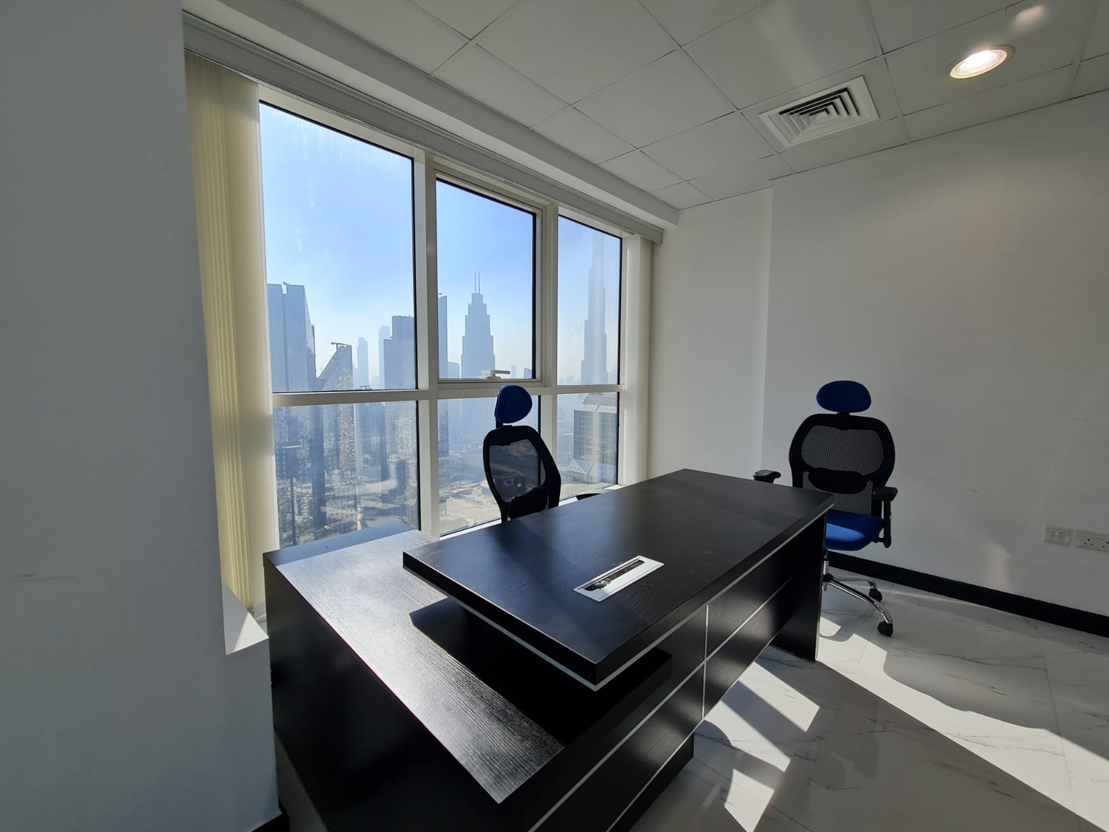 Private office interior at Finest Business Center with Downtown Dubai skyline view